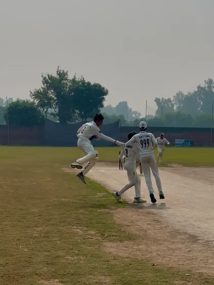 An athletic celebration after taking a key wicket.