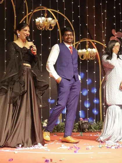 Having a laugh with family members on stage. Spontaneous, unscripted moments of joy are often the most memorable.