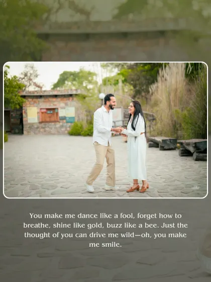 A candid shot of the couple dancing and laughing in a stone courtyard in Jaipur, full of genuine happiness.
