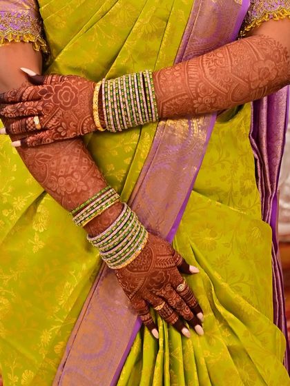 This is how your mehendi will look on your big day. The beautiful, dark stain complements the bride's bangles and colorful saree perfectly.