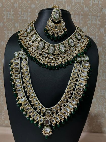 Jewels that speak for themselves. This is our green Kundan layered bridal set, featuring a choker and a matching long necklace for a truly royal look.