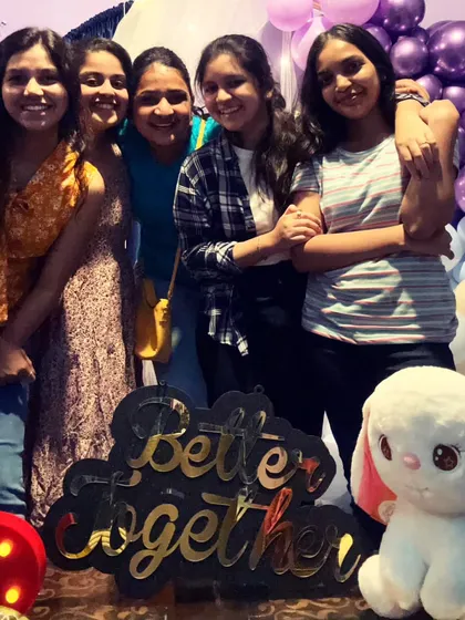 Another happy group photo from a friends' get-together. The custom props and decorated background make every picture special.