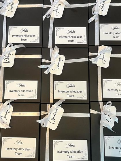 These sleek, personalized gift boxes were created for the Saks Inventory Allocation Team. Each box is individually tagged with the recipient's name, adding a personal touch to a large corporate order and making every team member feel valued.
