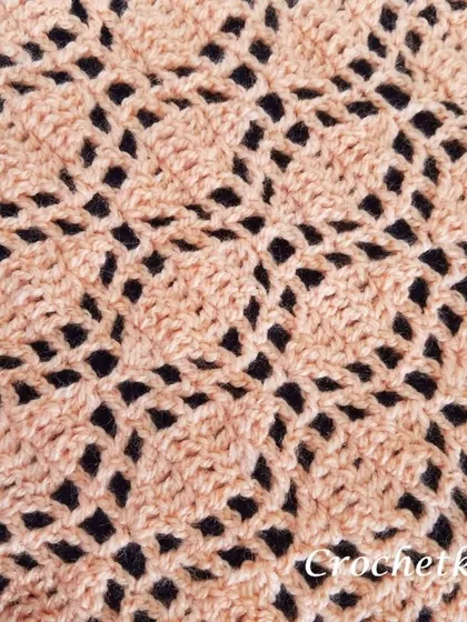 A close-up of the simple two-stitch repeat that creates this romantic, lacy fabric. It's a great first lace project for new crocheters.