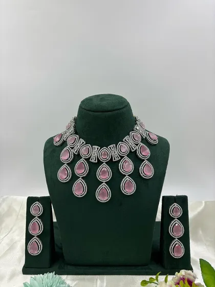 A modern necklace with large, teardrop-shaped pink stones.