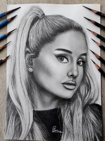 The full A4 view of the completed Ariana Grande graphite portrait, showcasing the balance between sharp details and soft textures.