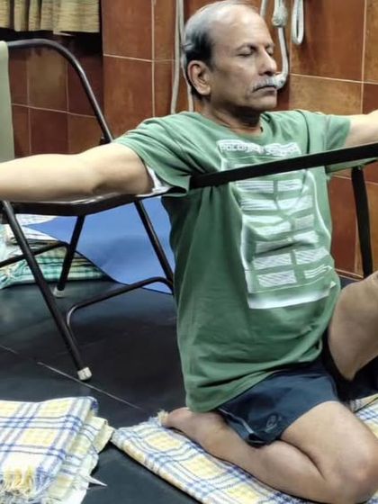 A seated leg stretch with a strap.