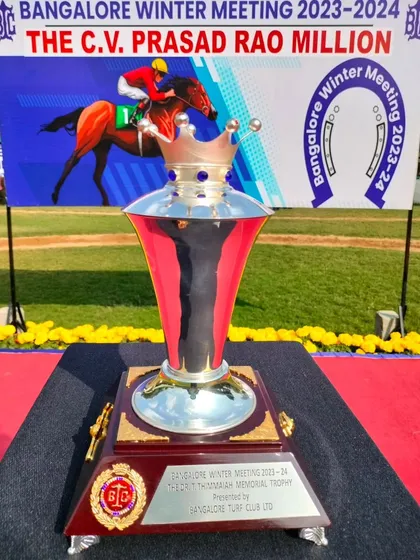 The Dr. T. Thimmaiah Memorial Trophy, featuring a crown-like top.