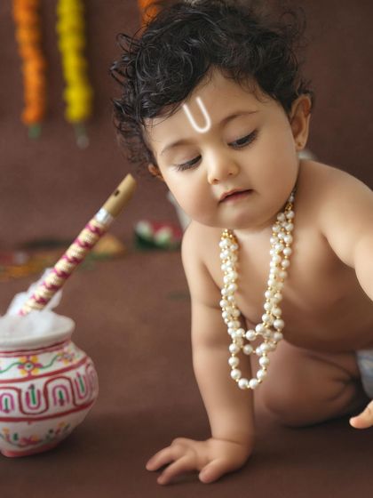 A beautiful close-up of a baby crawling, capturing the innocence and charm of a little one dressed as Krishna.