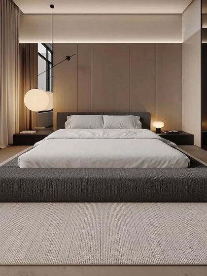 A full view of this minimalist yet luxurious bedroom. The design is all about clean lines, open space, and a calm atmosphere.