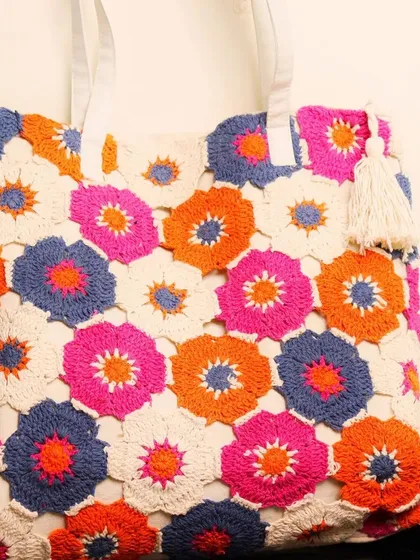 I wanted to show you a close-up of the detailed crochet work. Each hexagon is handmade by me using high-quality cotton thread. The finishing and the bright colors are what make this bag special.