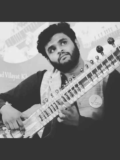 A black and white shot from the Gurupoornima concert. The monochrome effect highlights the timeless and classic feel of a Hindustani music performance.