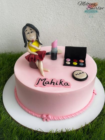 A makeup-themed cake for the diva in your life. This design features handmade fondant makeup items like lipstick and an eyeshadow palette.