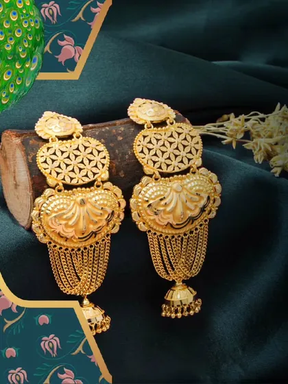 Earrings as unique as your personality. These large, ornate gold earrings feature a heart-shaped motif and cascading chains, designed to make a bold statement.