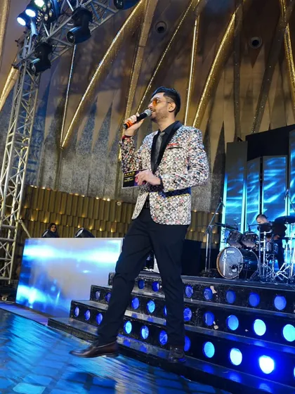 Caught in motion, this picture shows my on-stage energy. I am always moving, engaging, and ensuring the vibe is electric from the first song to the last.