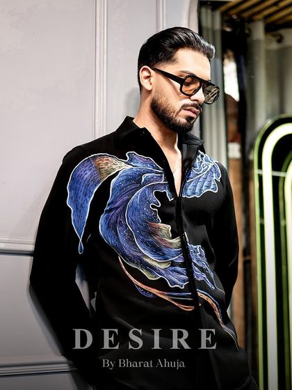 A pensive pose in the abstract wave shirt. The artistic design makes it a true conversation starter.
