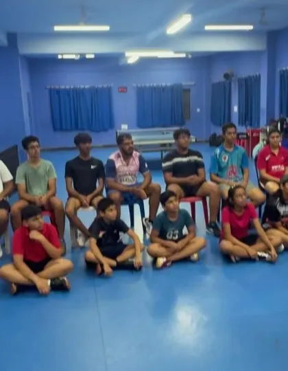 Players of all ages listen intently during a group mental conditioning session. We ensure every athlete has access to tools for mental toughness.