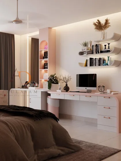 A functional and stylish vanity and study area in the same pink and white palette, with curved floating shelves and ample storage.