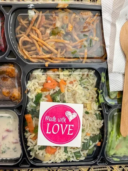 A meal box with a "Made with Love" sticker, showcasing the personal touch I add to every order.