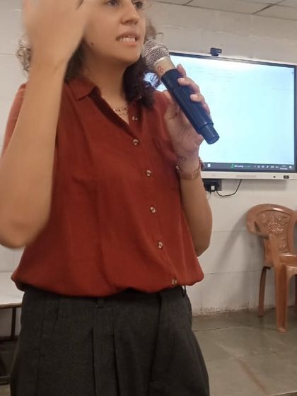 Speaking to teachers during a training session. I often share personal anecdotes and reflections on my own journey to connect with educators and show them that embracing play and even a little bit of madness is key to joyful teaching.