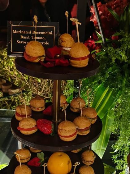 Bite-sized savory profiteroles filled with marinated bocconcini, basil, and tomato. These are a perfect pass-around appetizer for a sophisticated cocktail hour or high-tea.