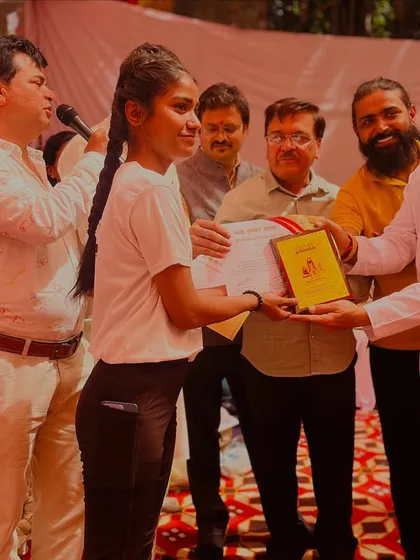 A happy moment as my student receives her award. I am present to support and cheer for my students at every step.