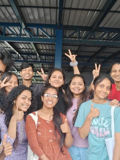 A happy group of volunteers after a successful weekend event. The smiles and thumbs-up say it all!