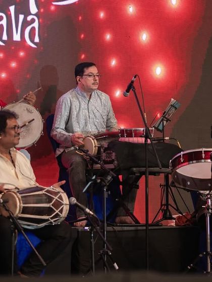 The incredible percussion section of my band at the Bengaluru Ganesh Utsava. Their intricate rhythms, combining mridangam, tabla, and drums, are a core part of our fusion sound.