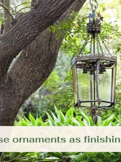 Don't forget the finishing touches. Ornaments like this vintage-style hanging lantern can add character and a sense of history to your garden design, making it feel unique and personal.