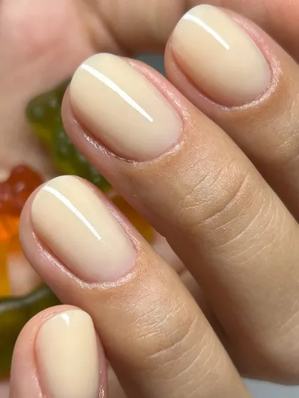 A creamy, jelly-nude manicure that is the epitome of 'your nails but better'. The semi-sheer finish is clean, healthy-looking, and effortlessly chic.