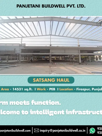 Form meets function in our intelligent infrastructure. This wide shot of the Satsang Haul project displays the expansive, multi-level framework of the Pre-Engineered Building.