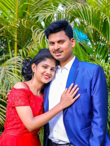 A sweet and happy close-up of the couple. The bride looks radiant in her red dress, perfect for a romantic pre-wedding shoot.