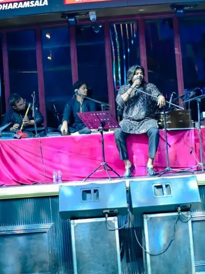 A wider view of our seated setup on a club stage, demonstrating how we can transform any space into an intimate mehfil.