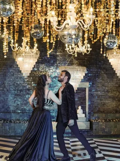 Under a ceiling of shimmering disco balls and crystal chandeliers, the couple shares their first dance. I design glamorous Sangeet and Cocktail nights that feel like a scene from a movie.