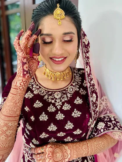 The most rewarding part of my job is seeing a happy bride. Here is the beautiful Shahana, all smiles on her big day, with her henna stain looking rich and dark against her gorgeous velvet lehenga.