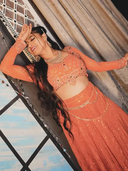 A dramatic, happy pose from the 'Jhanjhariya' shoot. I love the color of this outfit.