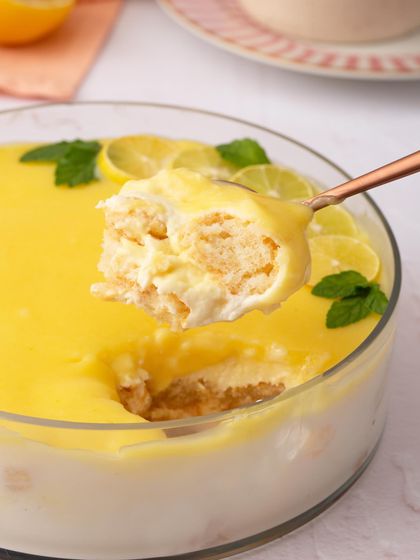 A spoonful of my Lemon Tiramisu, a refreshing twist on the classic. The bright, tangy lemon curd cuts through the richness of the mascarpone cream.
