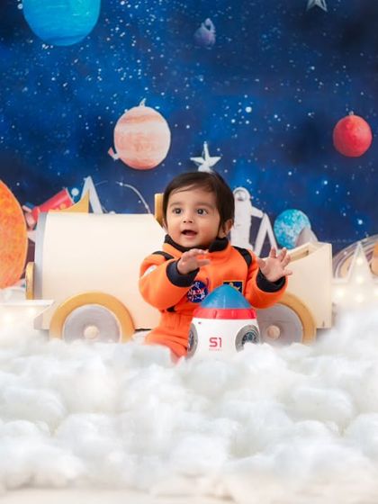 An astronaut floating in a sea of clouds. The wide shot shows the full scale of this imaginative and detailed outer space set.