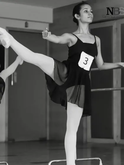At the barre during a training session. These foundational exercises are the building blocks of every step in ballet.