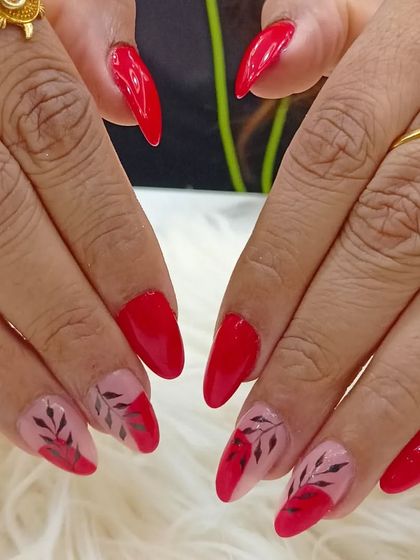 Another view of the elegant red and sheer nail set with black botanical art.