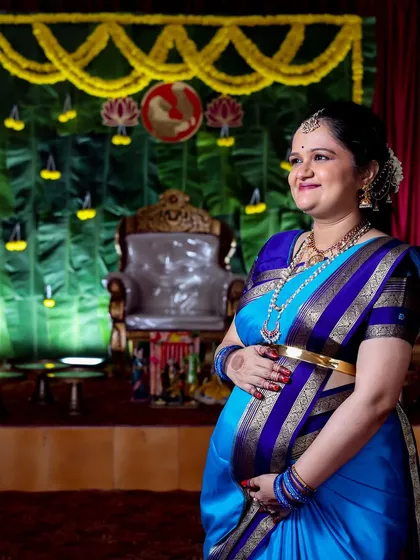 A beautiful portrait of an expecting mother during her baby shower ceremony. I use lighting to create a soft, classic look that highlights the glow of motherhood.