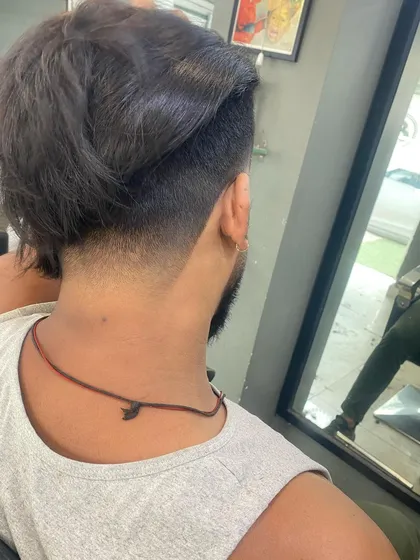 The back view of an undercut with longer hair on top, showing the sharp contrast in length.