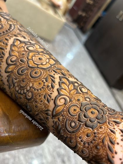 Another angle of Zoya's engagement henna, showing the texture and precision of the fresh henna paste.