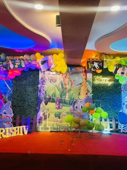 The jungle party stage under colorful party lights.