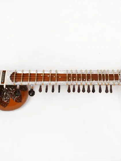 The neck of a Pandit Ravi Shankar style sitar, showing the upper tumba (gourd) and the numerous sympathetic strings that give it a rich, shimmering sound.