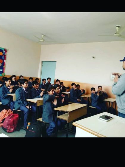 Involving students is the core of my teaching philosophy. Here, I am leading an interactive workshop, getting students to participate directly. This method ensures they remember what they learn because they are a part of the lesson itself.