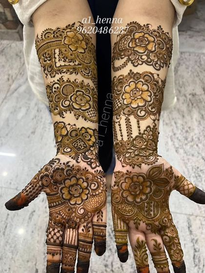 This design features beautiful floral bands across the hands and wrists, a popular choice for festive occasions.