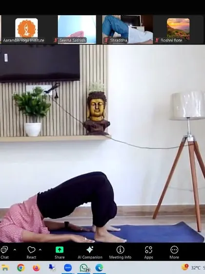 An instructor demonstrates Setu Bandhasana (Bridge Pose). This gentle backbend opens the chest and heart, which can help alleviate anxiety and mild depression by improving breath capacity and stimulating the adrenal glands.