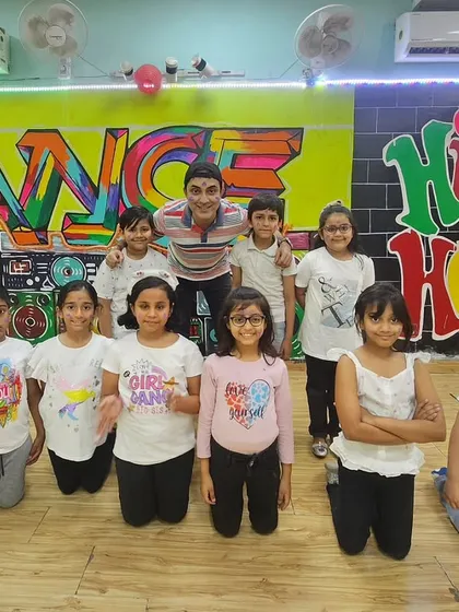 A group photo with the kids' batch during our Holi 2024 celebration at the studio.