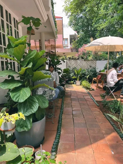 The full view of our beautiful garden seating area, where guests can enjoy their meals surrounded by nature.